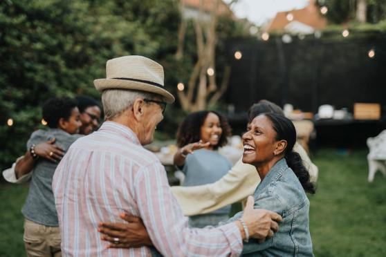 A group of people dancing together outside