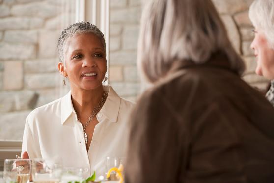 A group of woman sitting at a restaurant